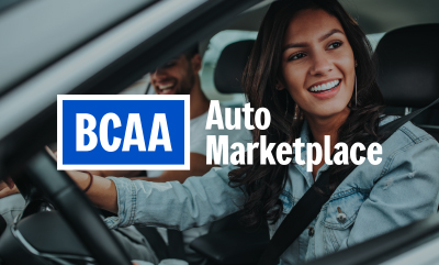BCAA Auto Marketplace logo over an image of a woman smiling in the drivers seat of a vehicle