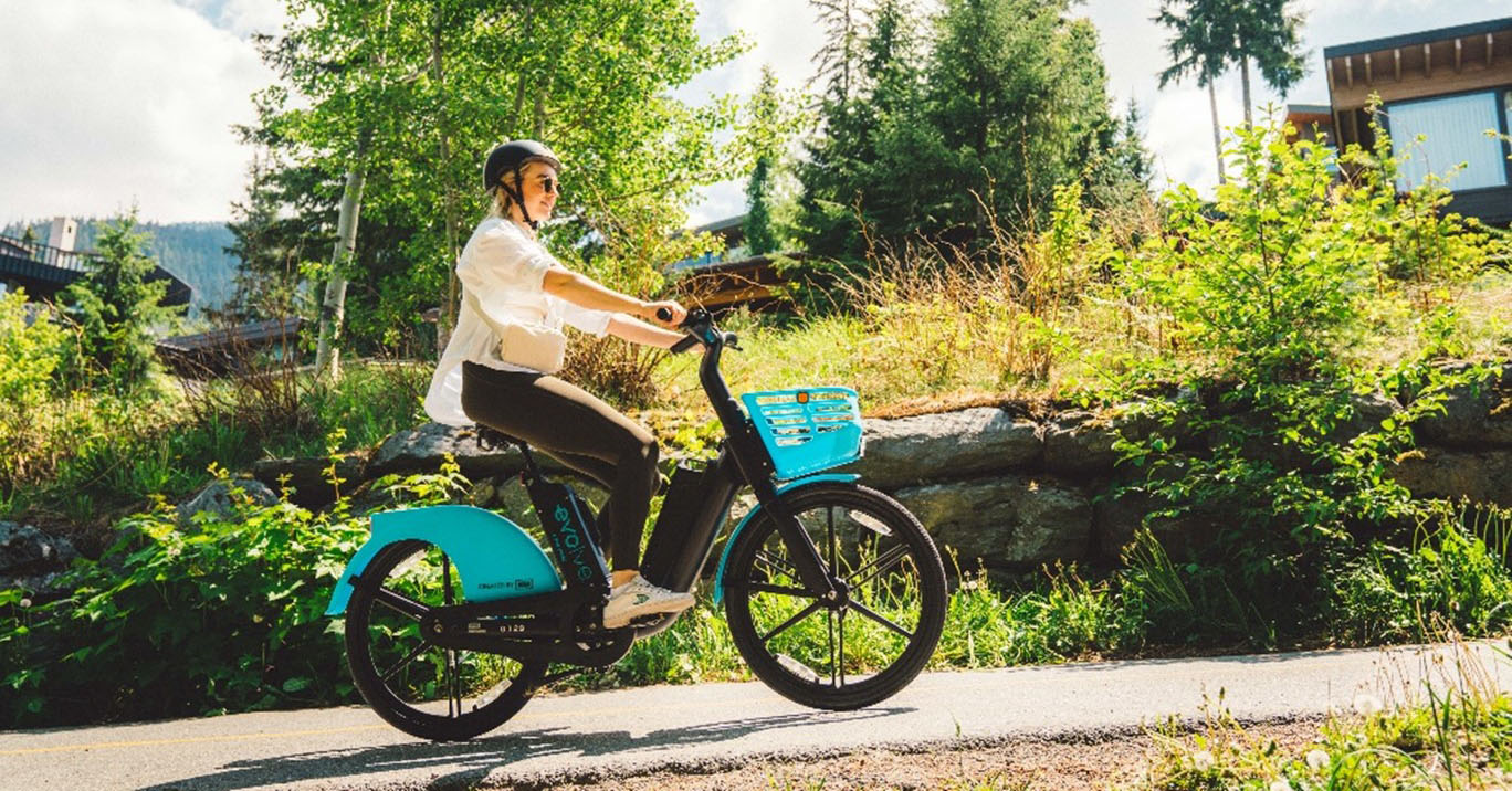 woman riding Evolve e-bike in Whistler