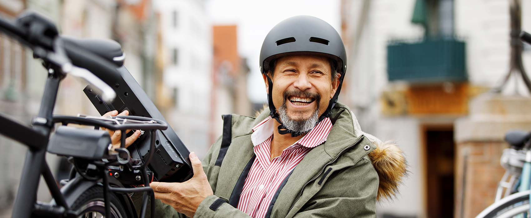 Man holding e-bike battery