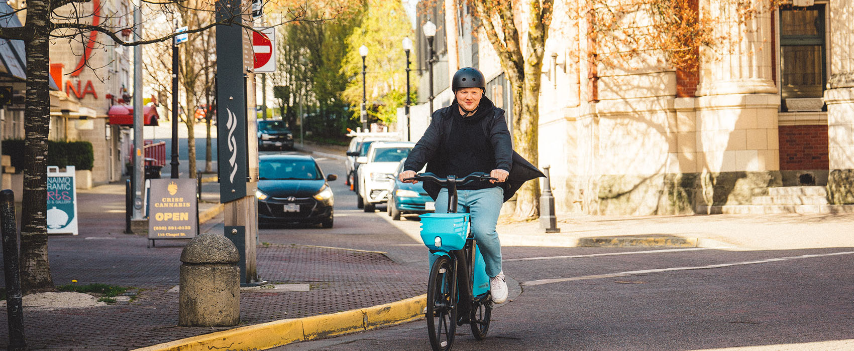 Man rides an Evolve e-bike through streets of Nanaimo