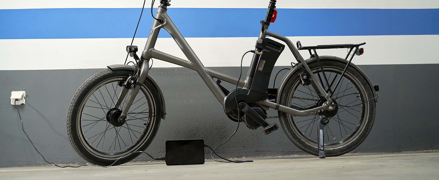 E-bike plugged into wall charging