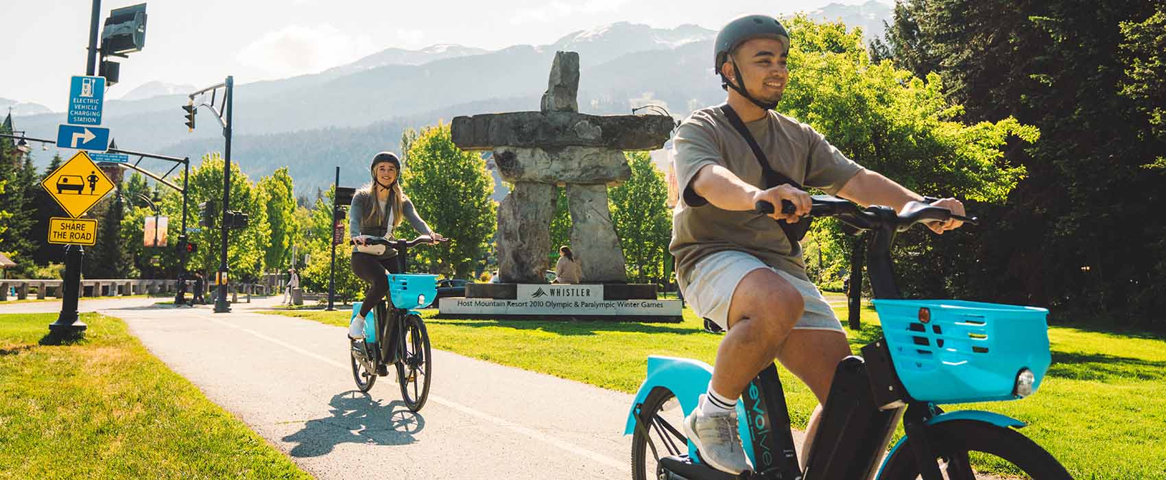 Evolve e-bikes being ridden through Whistler