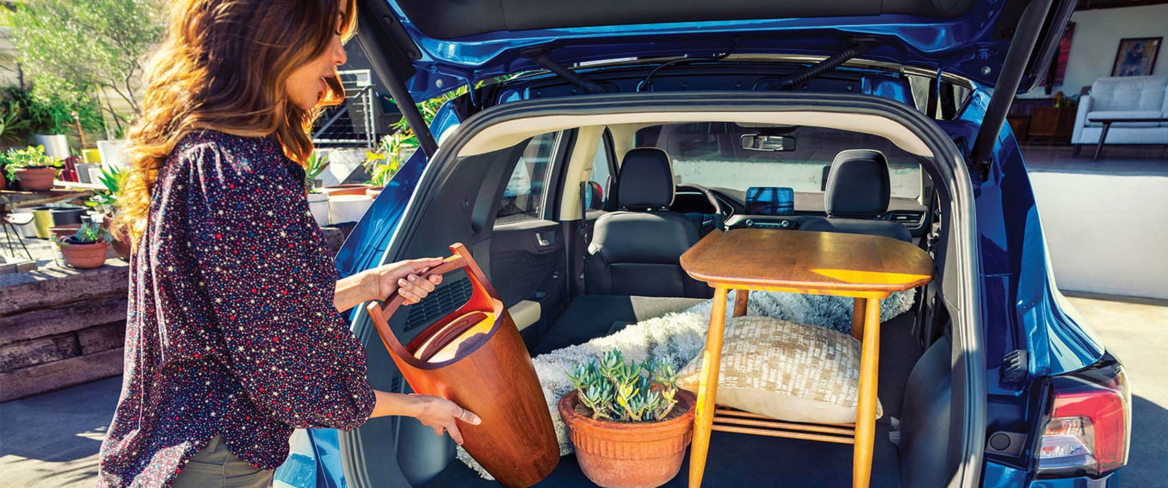 woman loading car trunk