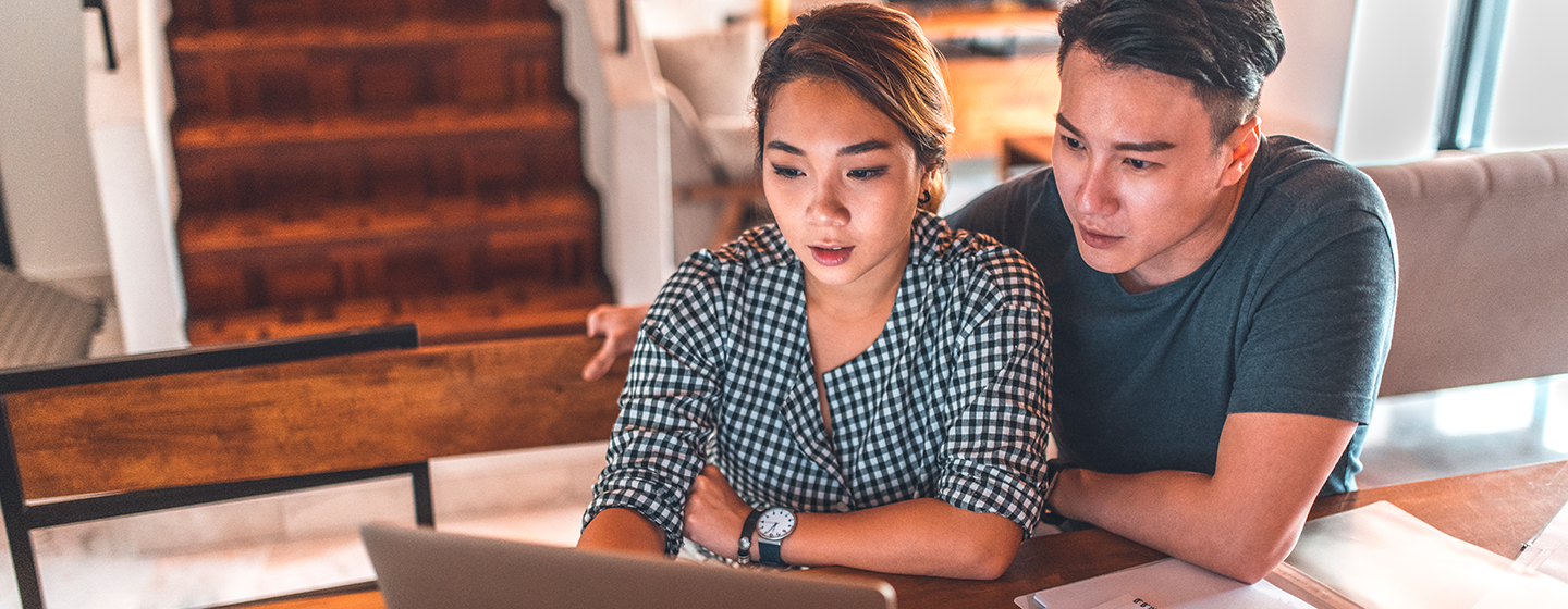 Couple using laptop