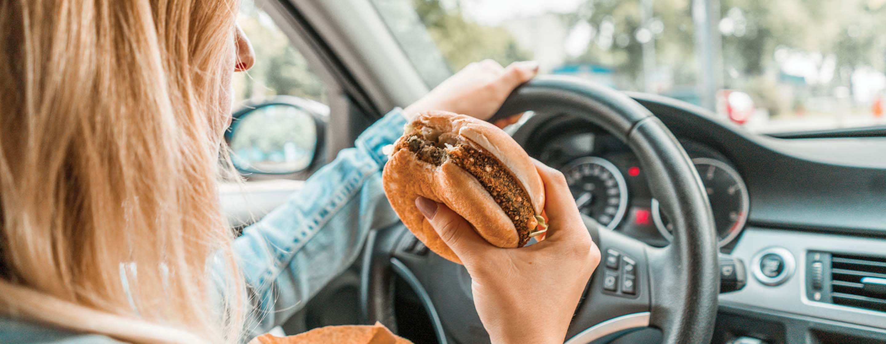 driver eating behind the wheel