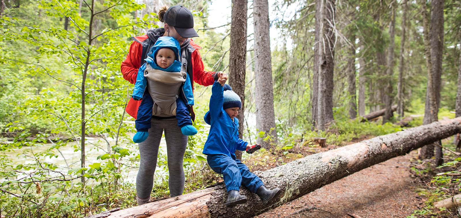 mother hiking with baby and toddler