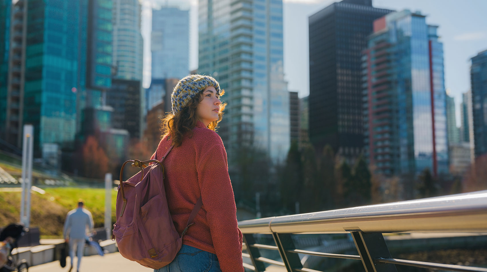 Woman walking along the waterfront in Vancouver city 