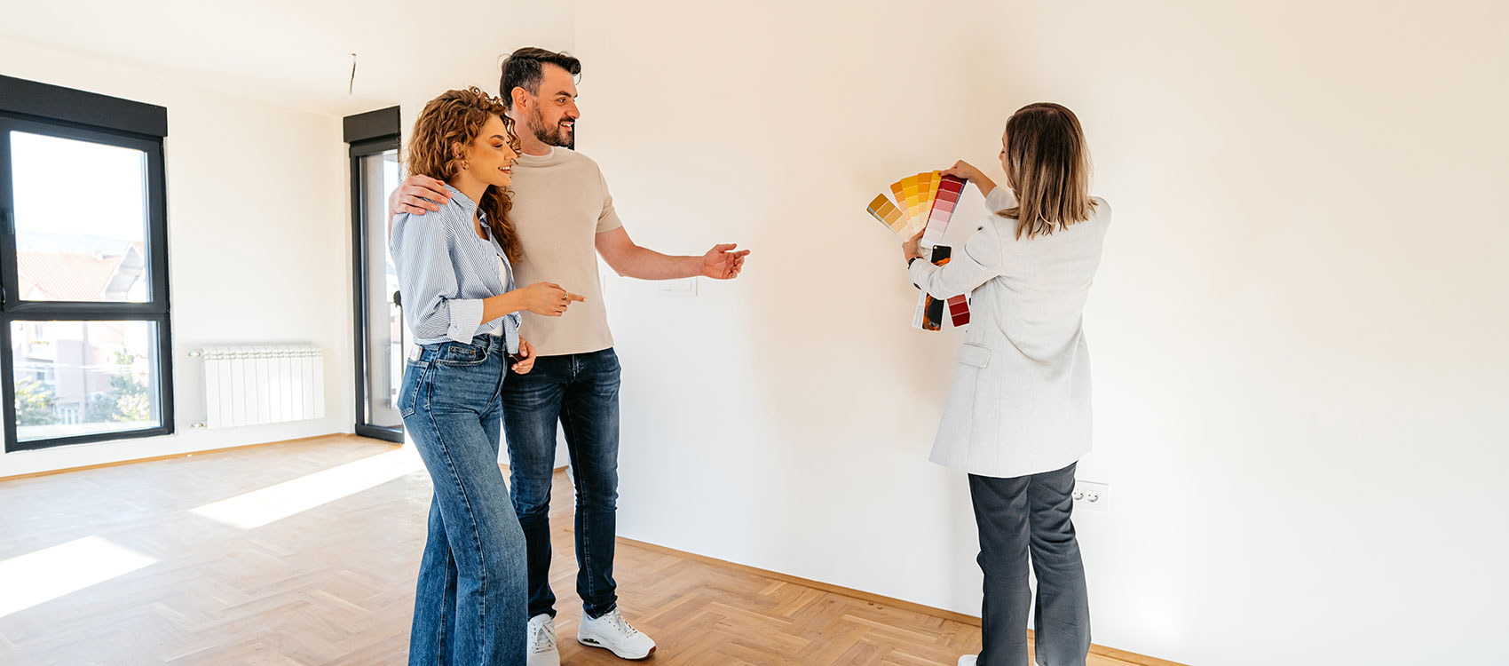 Architect sharing a color palette with a young couple at their apartment
