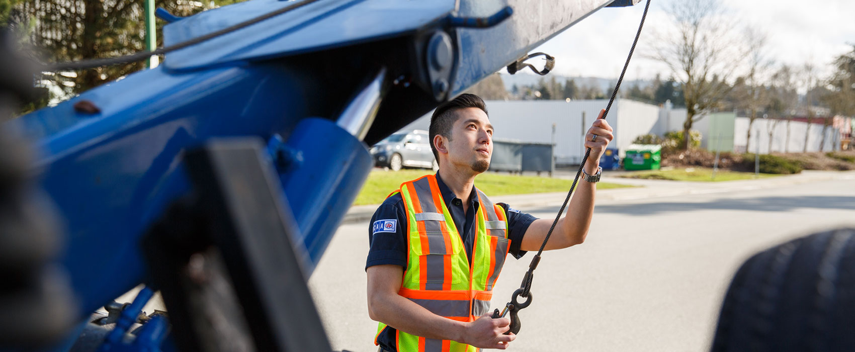 BCAA Road Assist team member helping a member with a broken car
