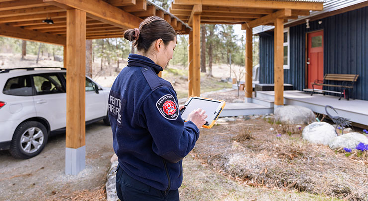 Fire inspector reviewing safety features inside a home