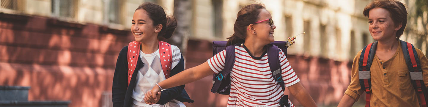 kids happily holding hands