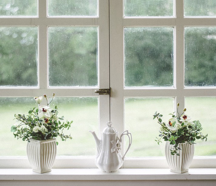 flower vases on window sill