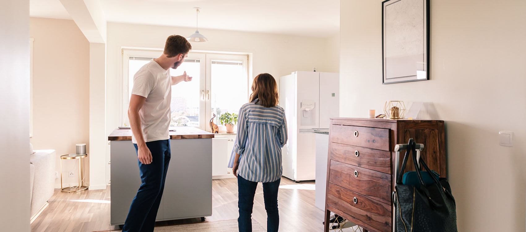 Landlord showing apartment to woman