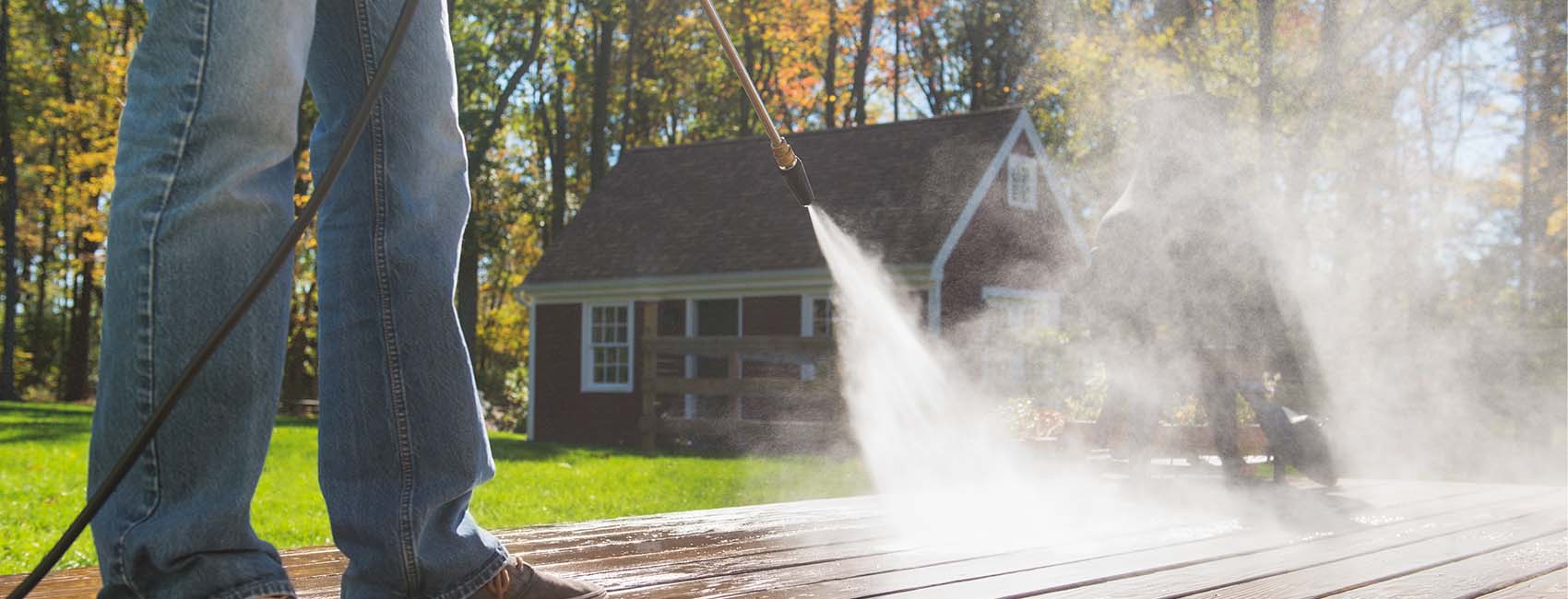 pressure washing a wooden deck