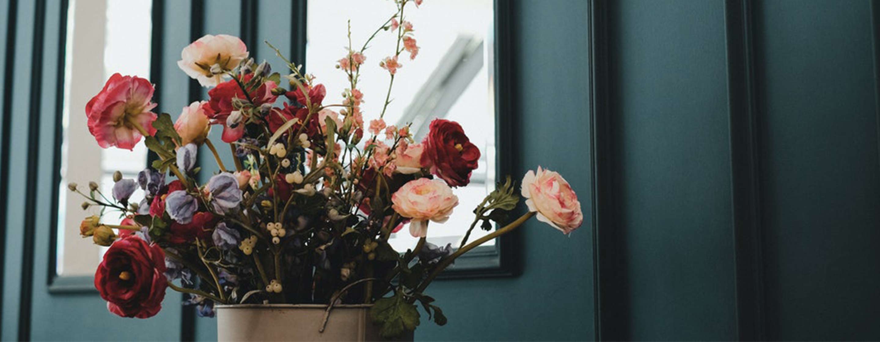 flowers in front of a mirror