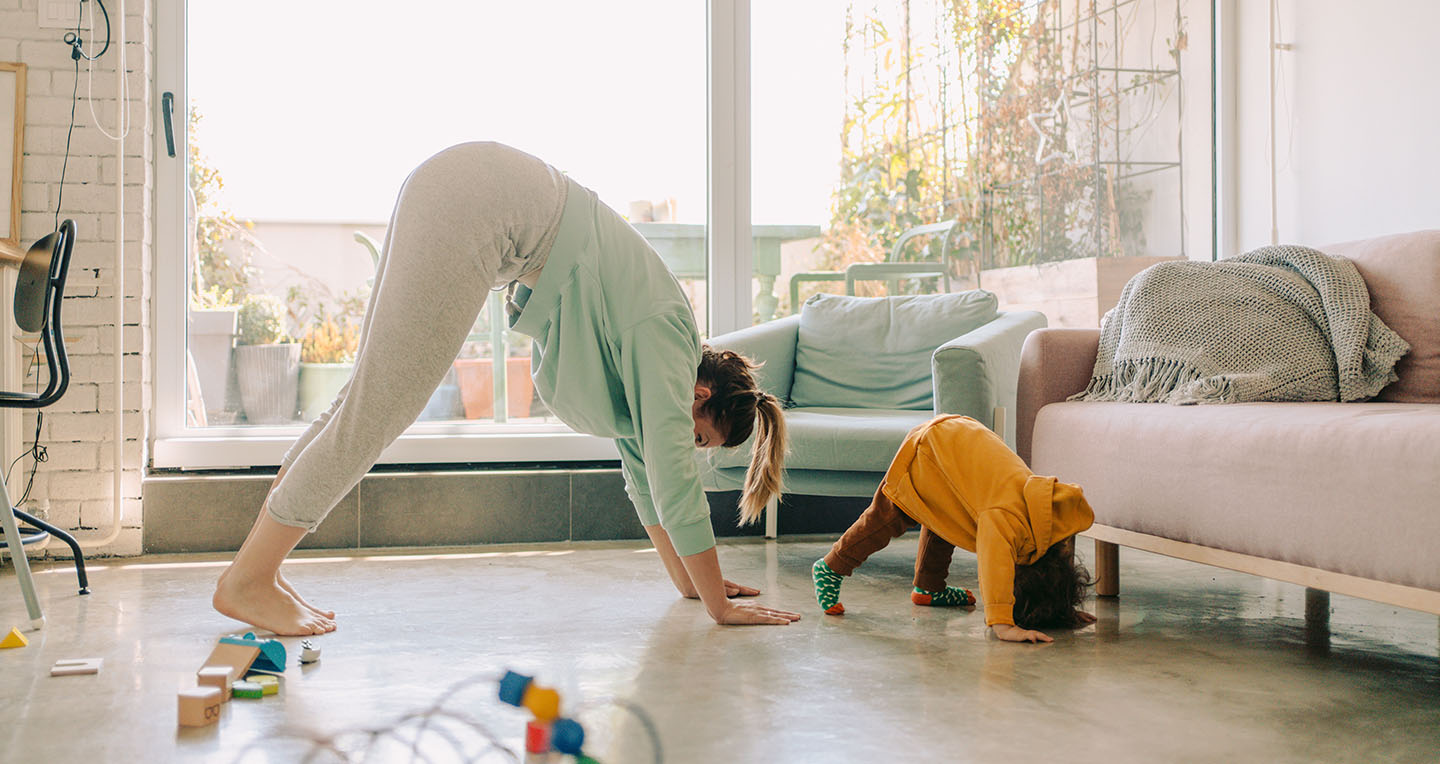 lady doing yoga with child