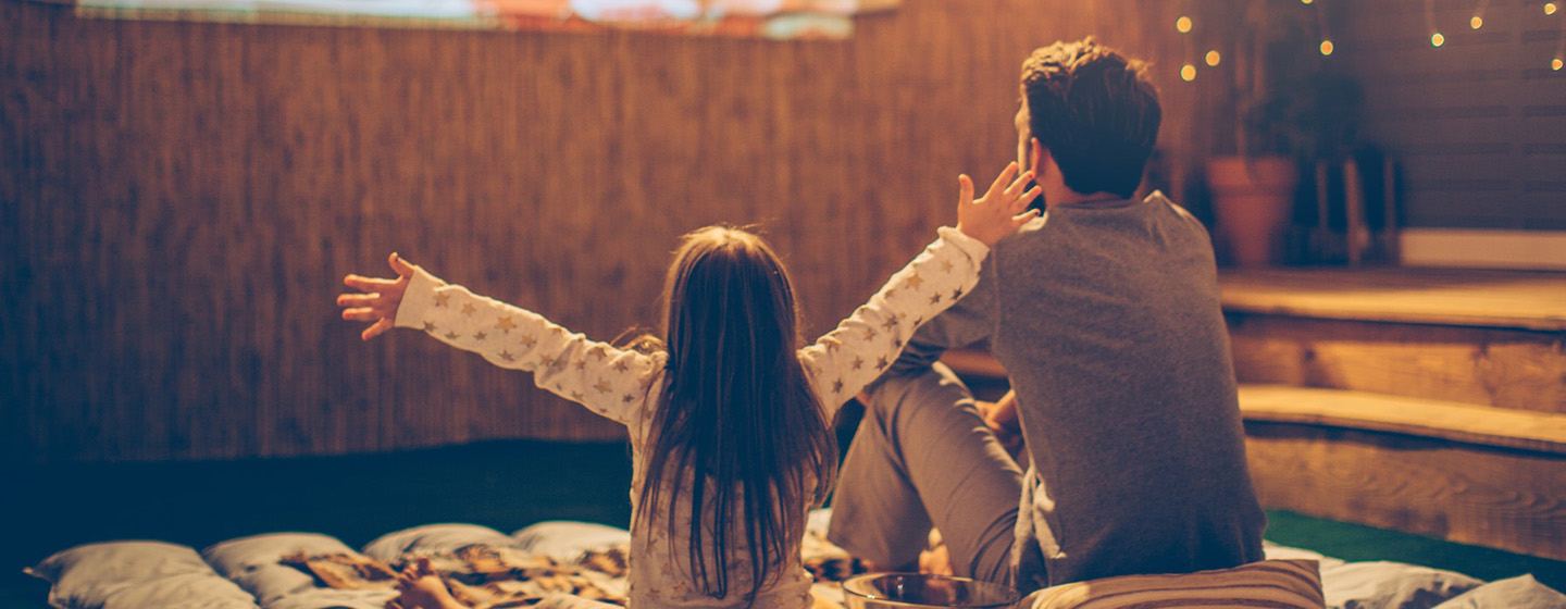 father and daughter sitting at home