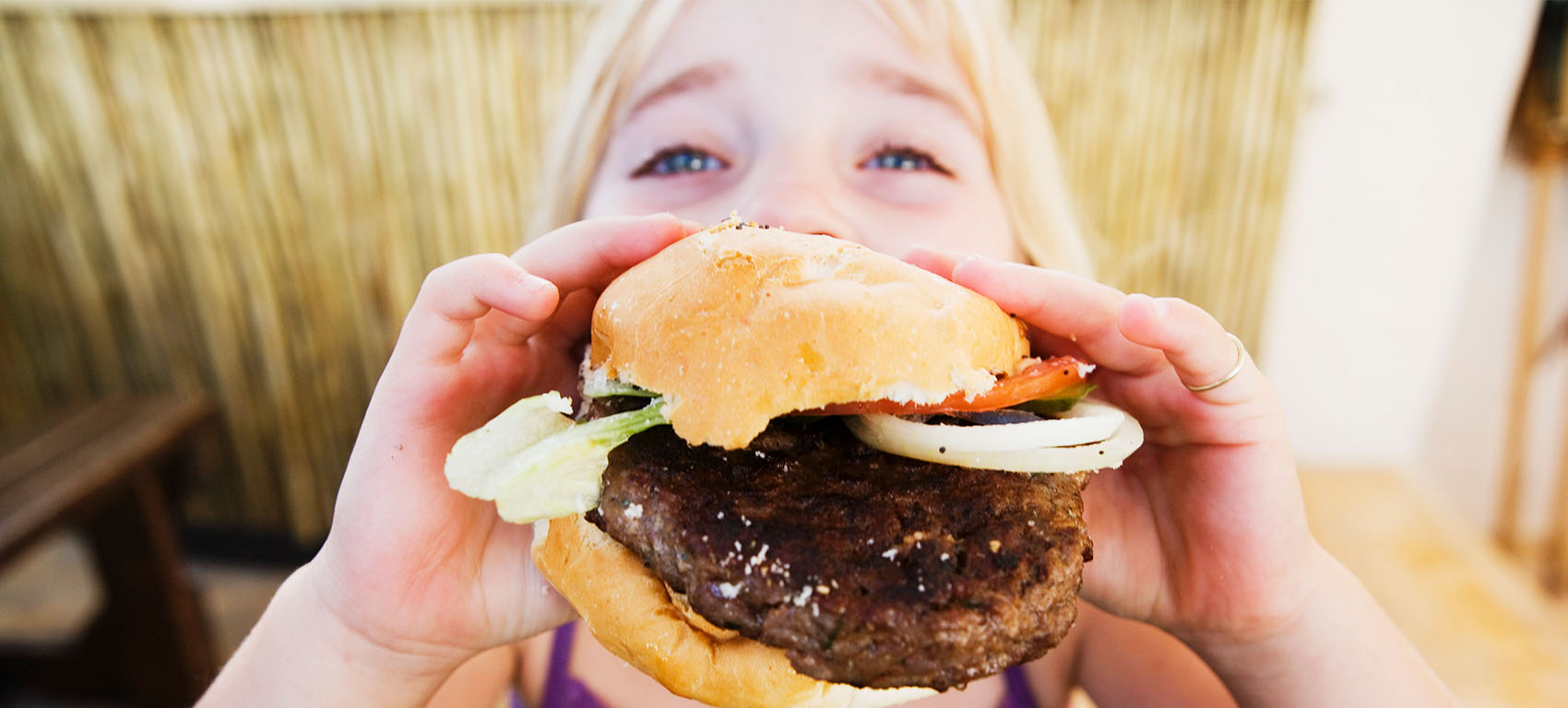 girl eating a burger