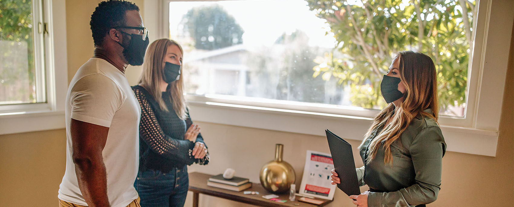 couple talking with real estate agent