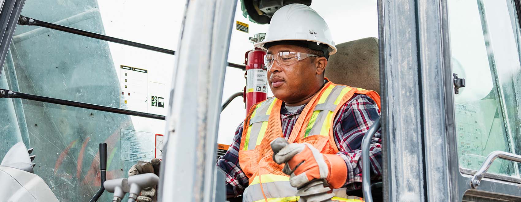 construction worker operating earth mover