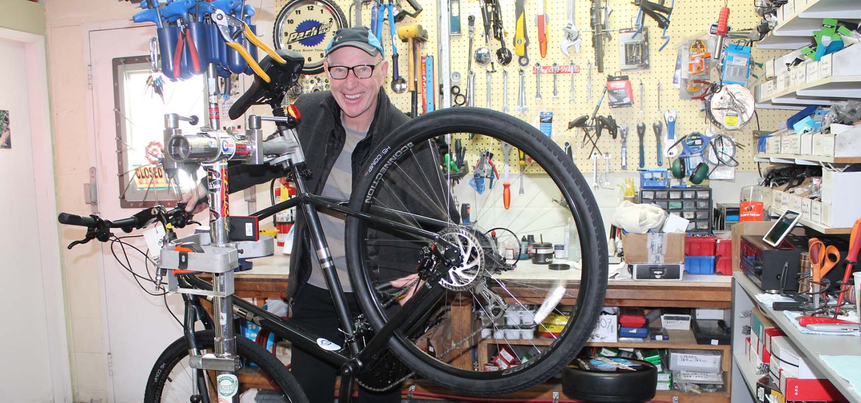 John Cope poses with a bike at Head Over Wheels Cycle & Sport