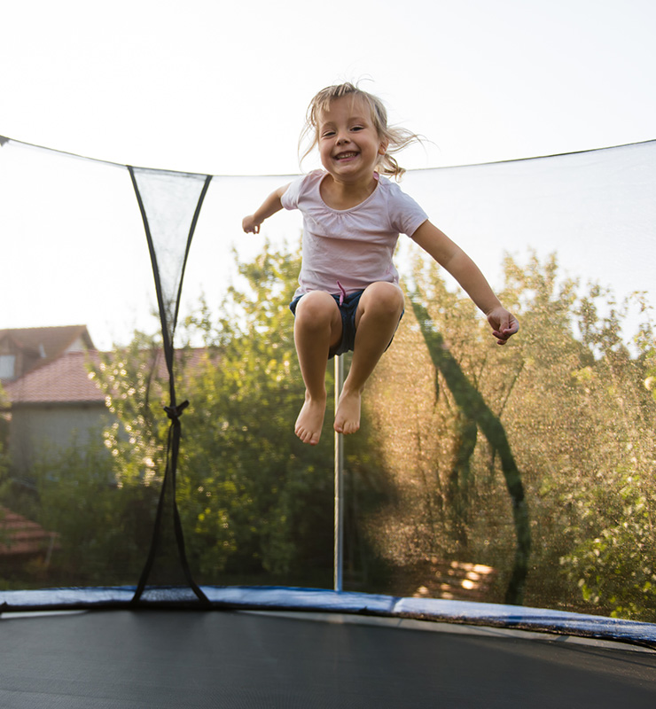 girl jumping on trampoline