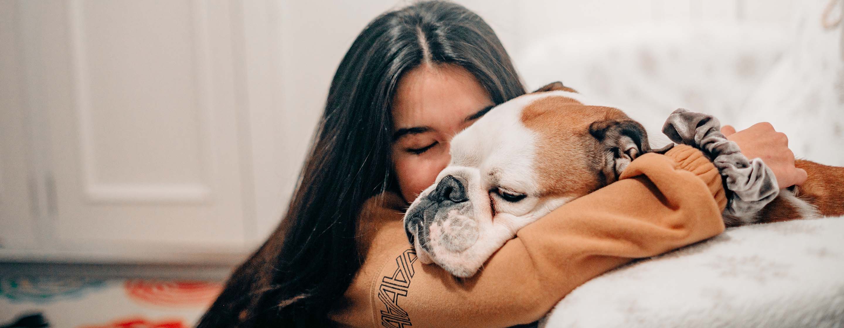 woman hugging her dog