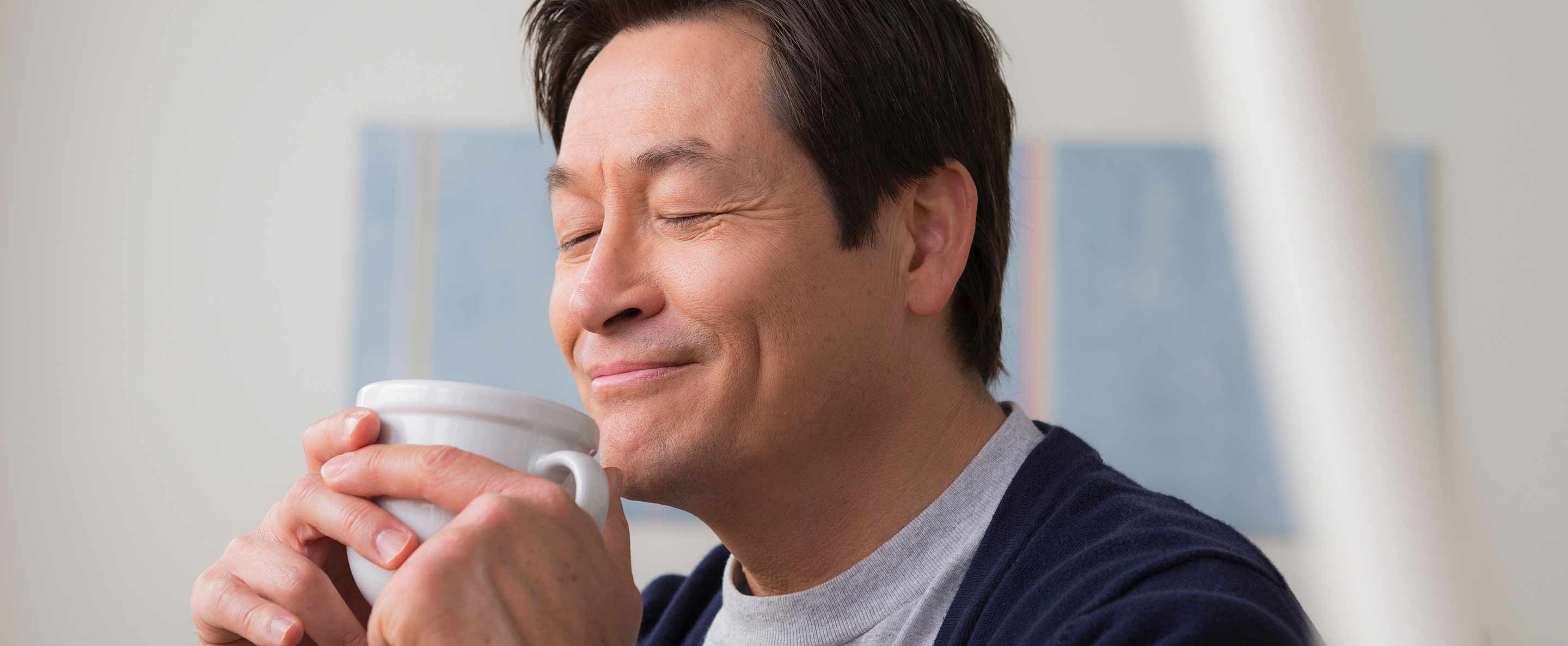 man enjoying his coffee