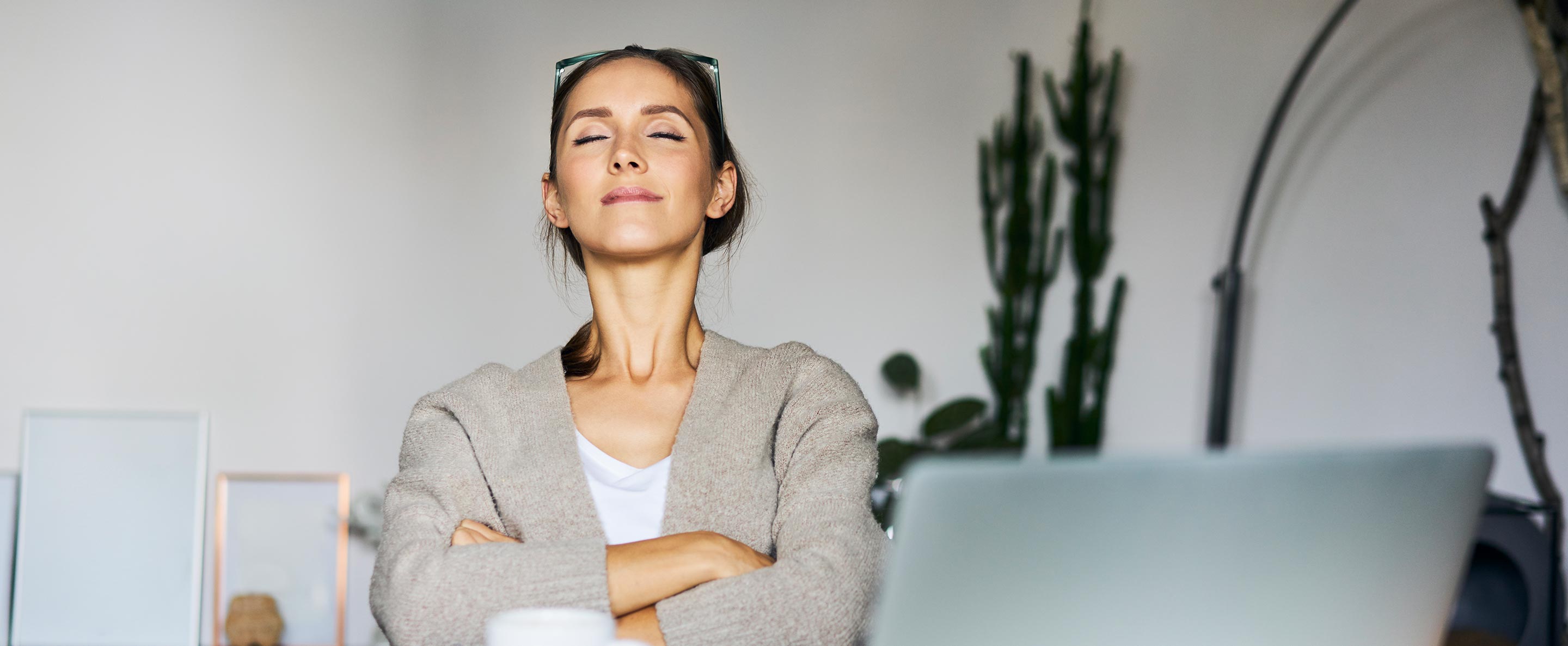 woman resting at home with laptop on desk