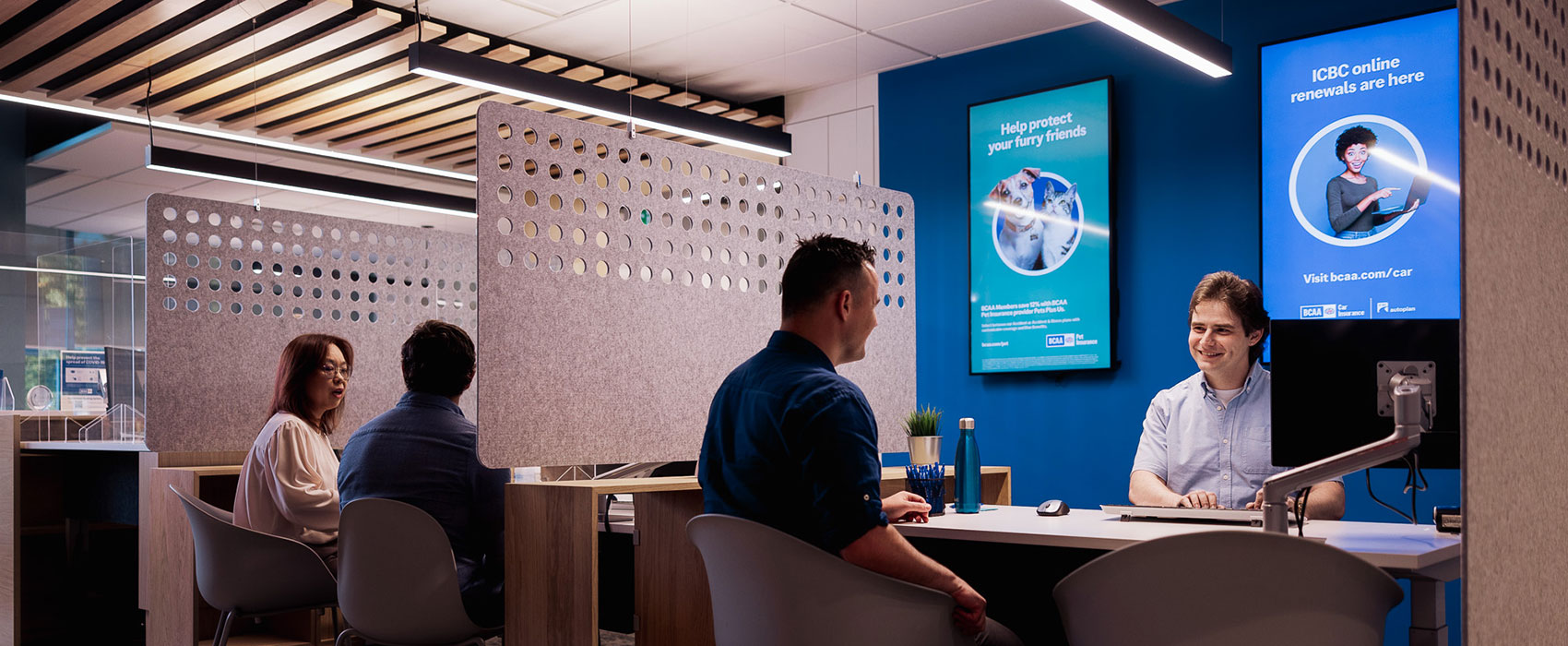 Customers receiving insurance support at a BCAA service location in BC