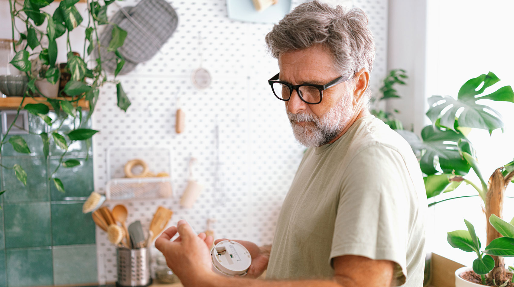 Man putting logs in fireplace