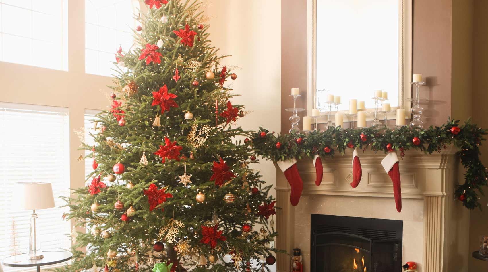 Woman relaxing in a knitted wool sweater, sitting in front of the fireplace 