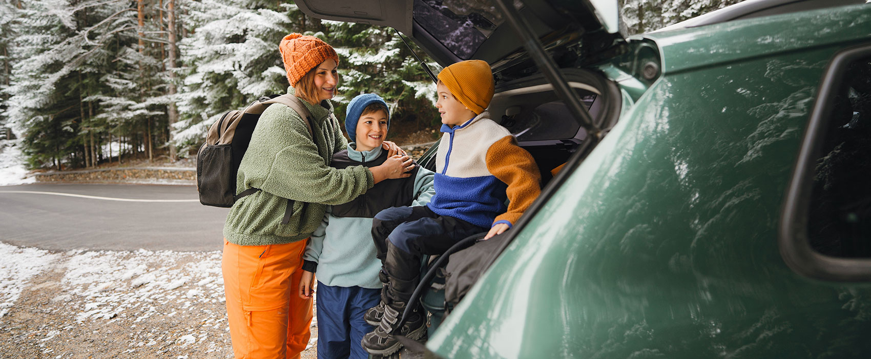mother and her boys on a winter road trip
