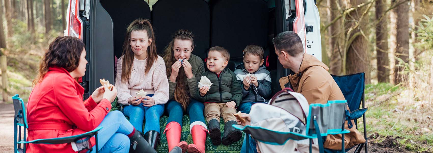 family eating their lunch on road trip