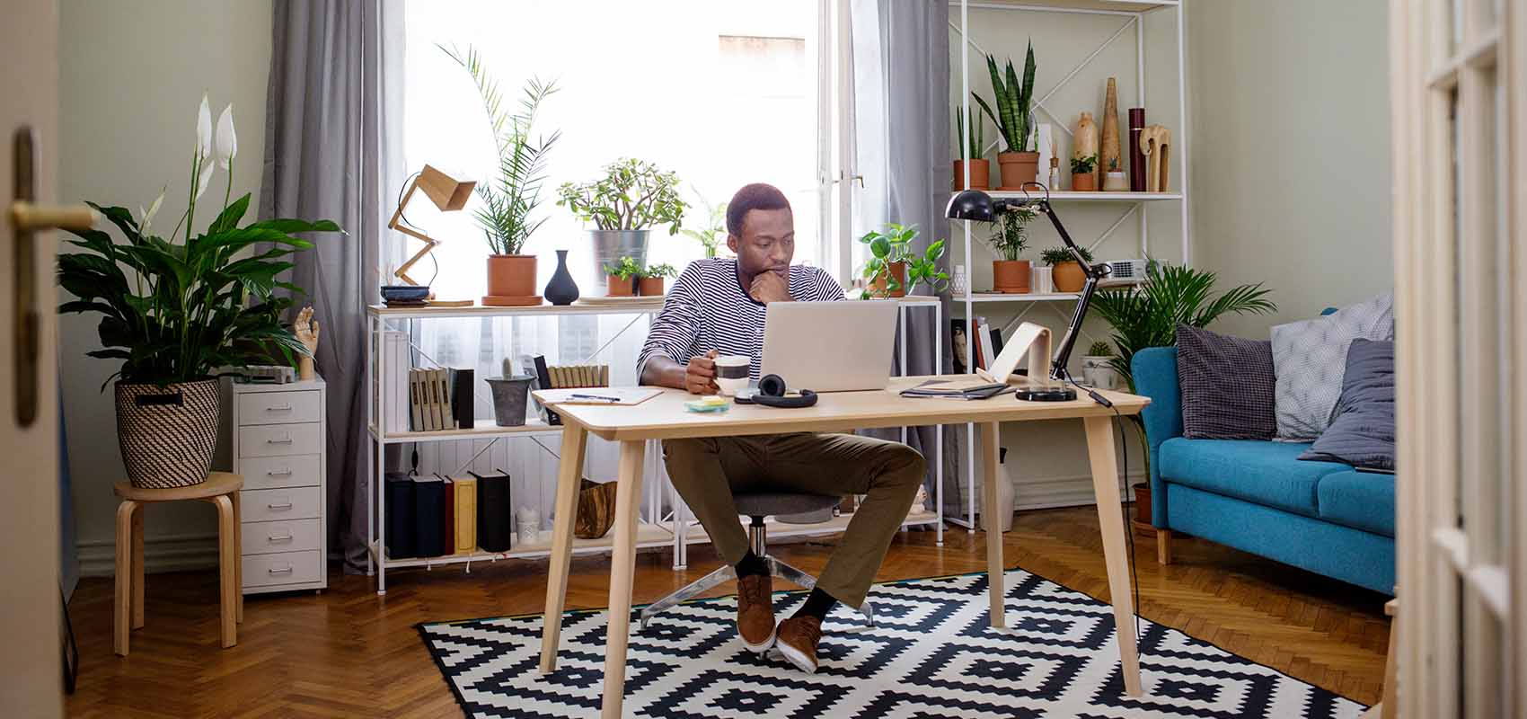 Man working on laptop at home office