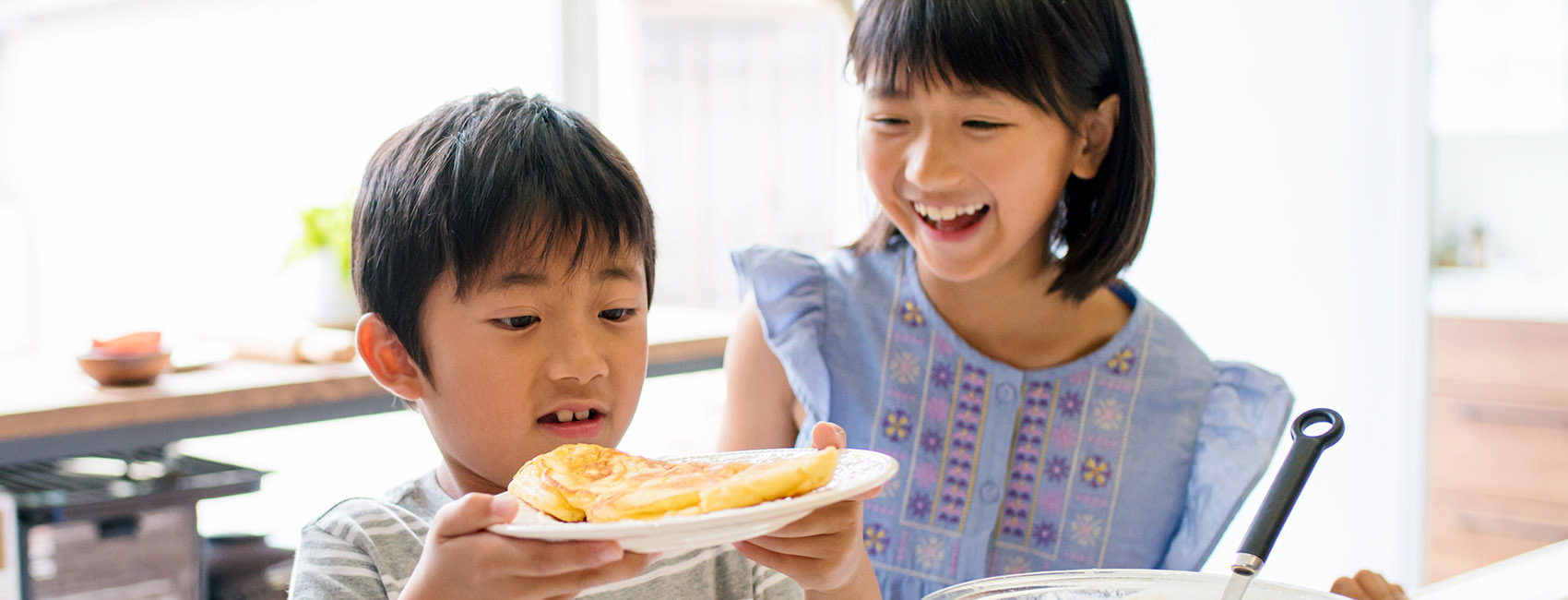 boy and girl making food