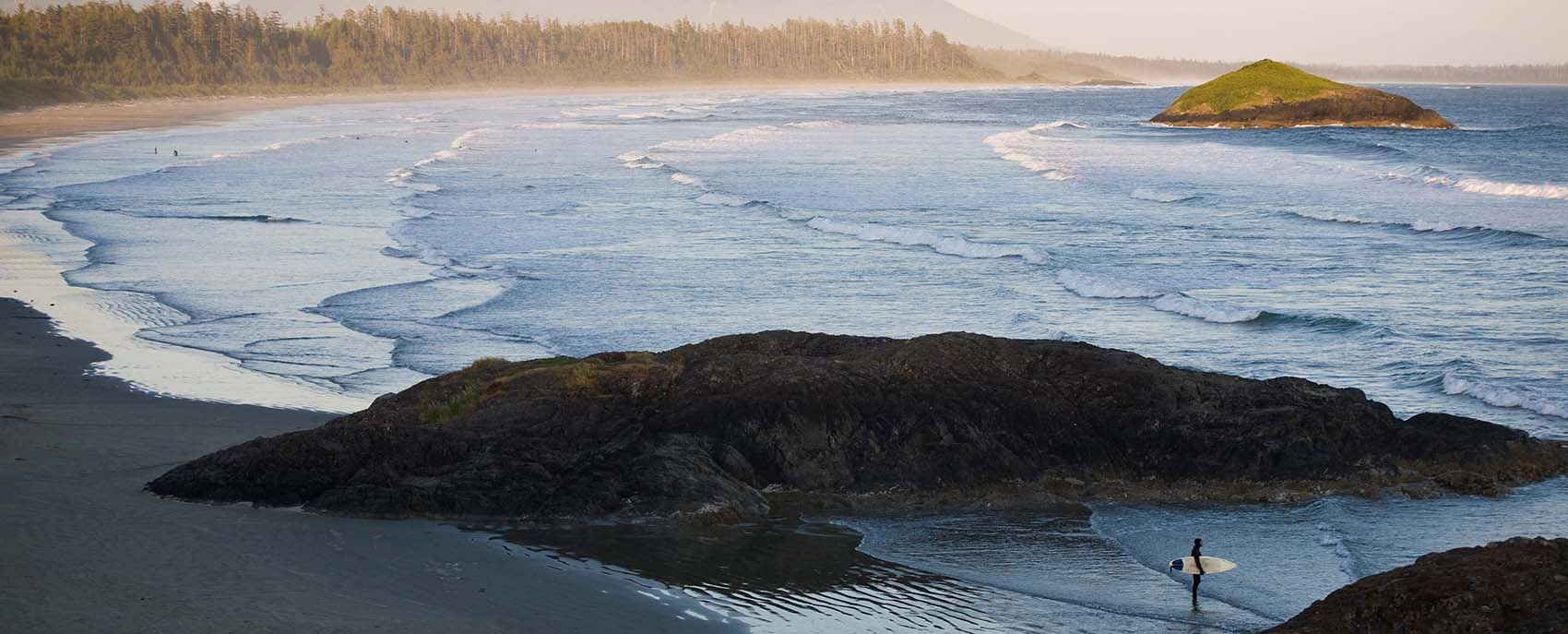 Surfer at Long Beach, Tofino, BC Canada