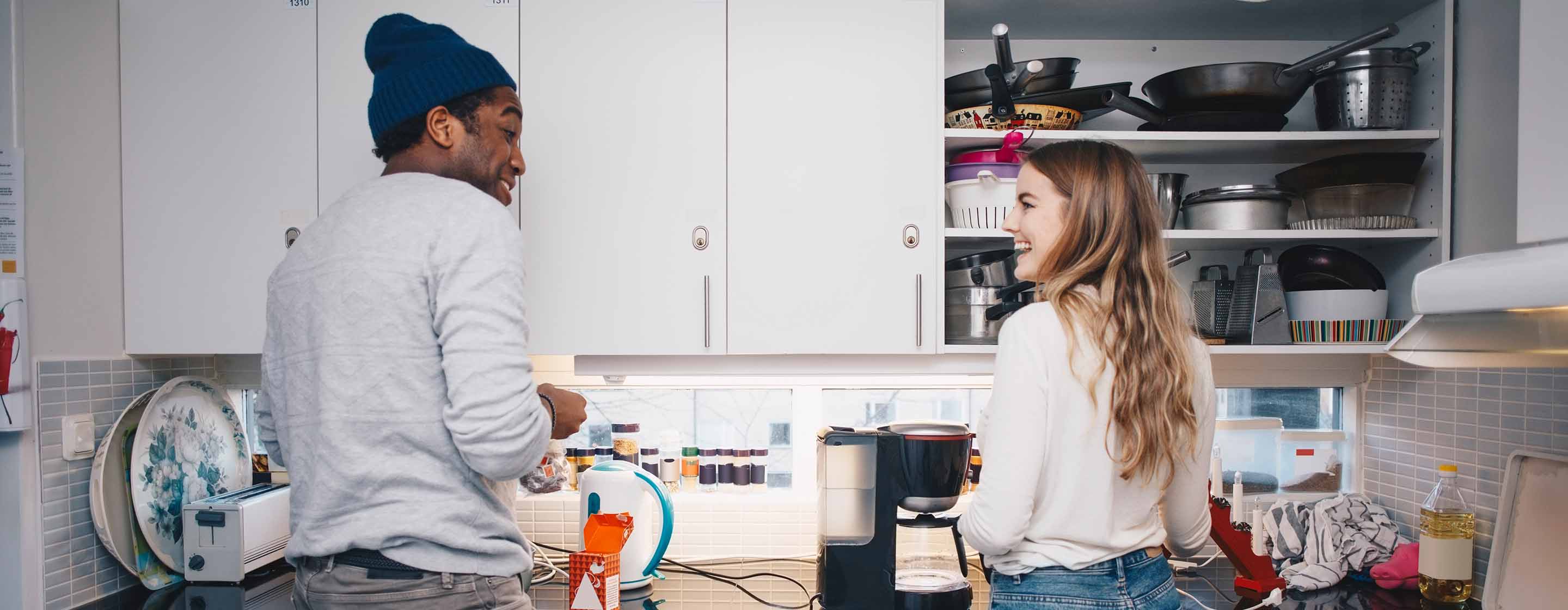 roommates cooking in kitchen