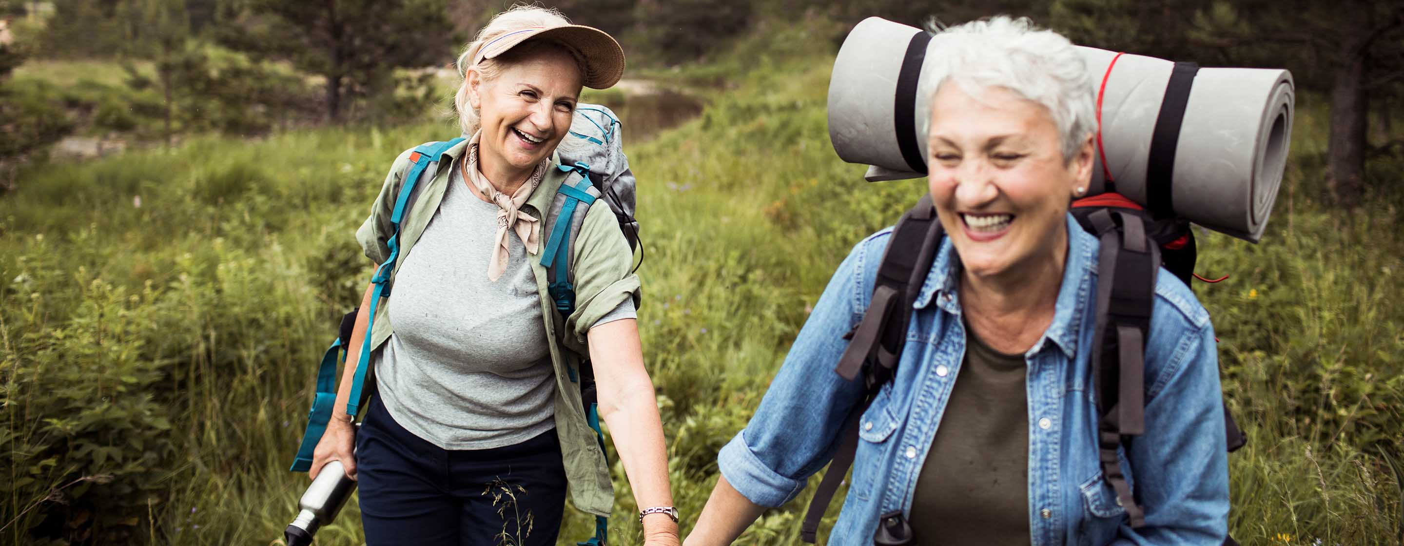 two senior women hiking