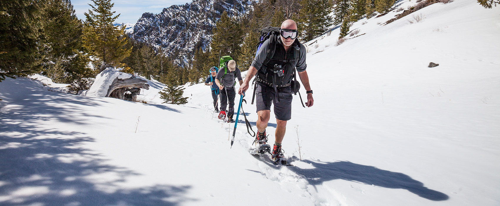 Climber trekking through a snowy trail