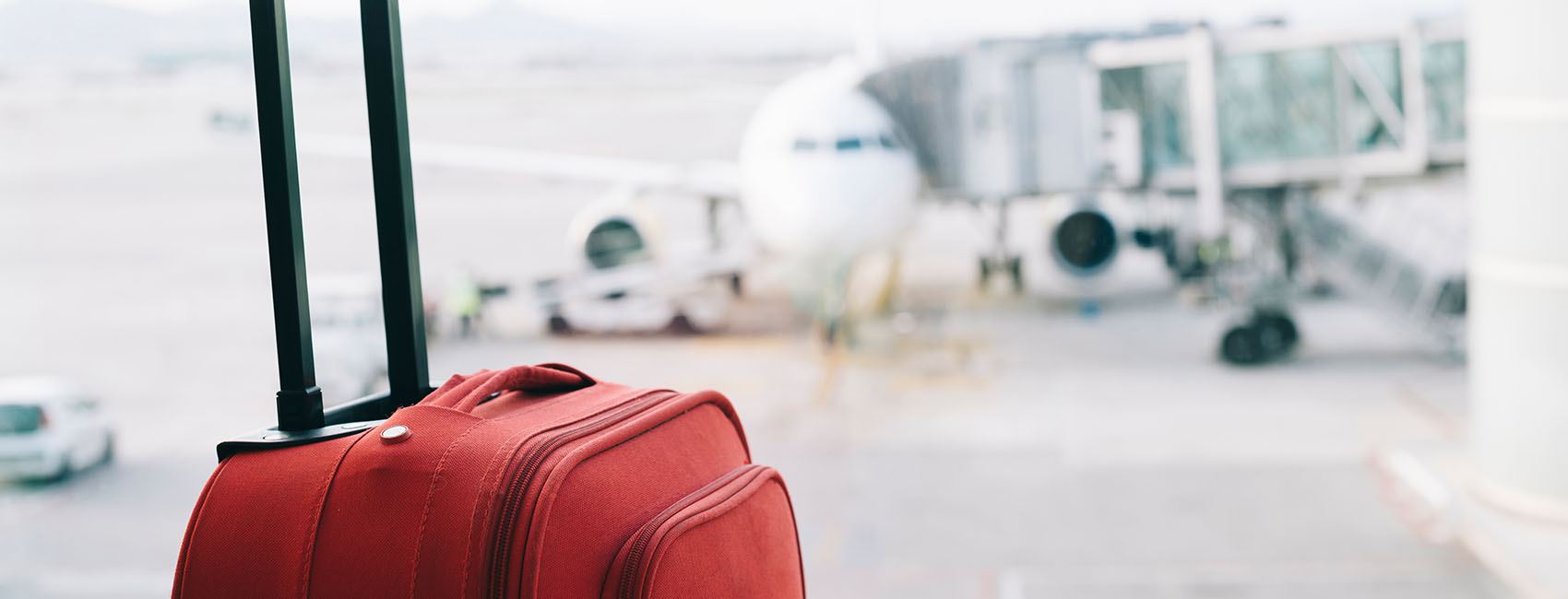 Red suitcase at airport