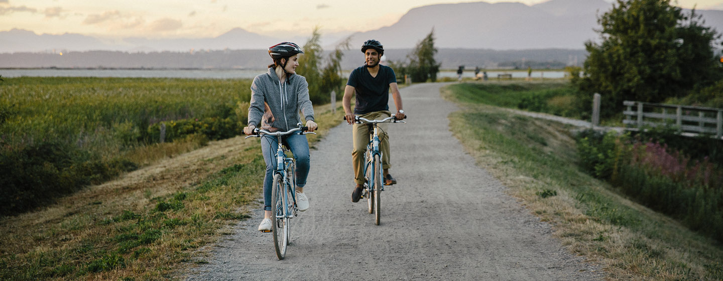 couple biking on trail