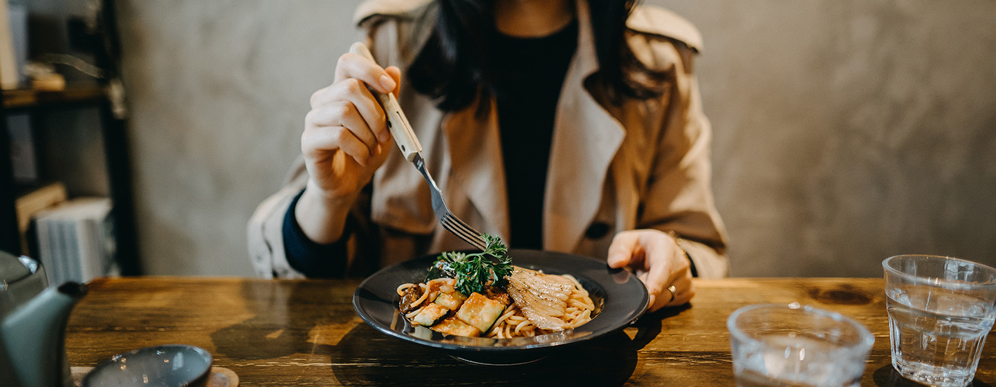 woman eating at restaurant