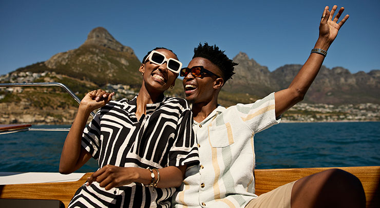 Happy man enjoying with girlfriend on sailboat
