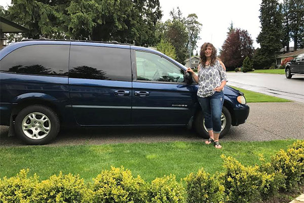 woman standing by van