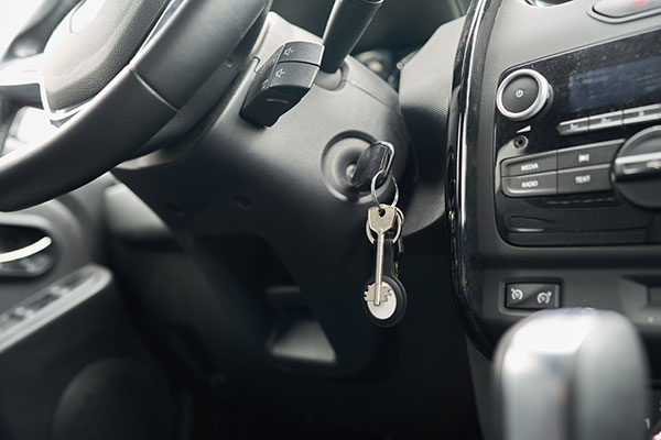 Car keys with an AirTag GPS tracker attached to the keyring