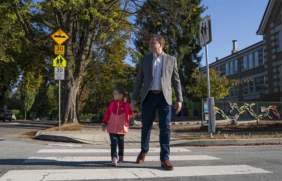 parent and child using crosswalk