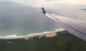 Plane flying through the sky