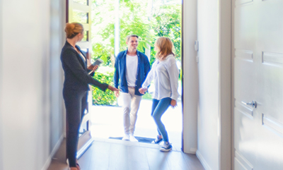 realtor showing couple