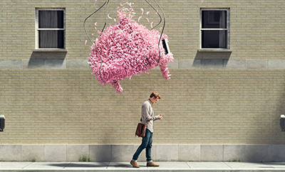 person walking under a feather piano